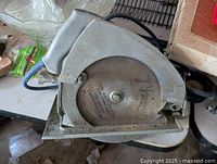 Top-down photo of the vintage circular saw showing metal saw blade and body.