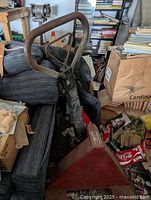 Front view of the pallet jack showing the handle and triangular pump housing.