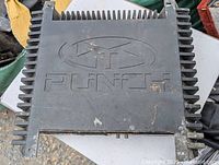 Top view of Punch P266.1 amplifier showing embossed logo and fin heat sinks on either side.