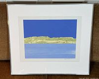 Full view of framed abstract print with signature visible on bottom right corner.