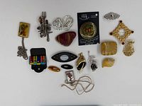 Overview photo of all brooches arranged on white background.