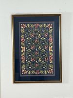 Full front view of framed Bird & Iris linen print against white wall