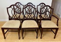 Six chairs arranged in two rows: four side chairs front, two armchairs back