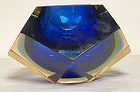 Front close-up showing deep cobalt blue sommerso glass inside faceted clear glass bowl