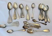 Overhead view of assorted spoons arranged in loose groups