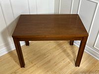 Front view of rectangular vintage mahogany coffee table showing solid wood construction and finish.