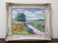 Full view of painting and ornate frame