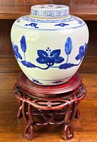 Front view of the jar and stand showing overall design.