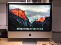 Front view of powered-on iMac showing screen and front bezel