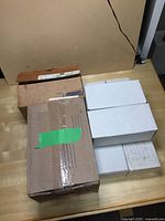 Multiple sealed and taped boxes containing the trading cards collection.