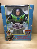 Front view of the Buzz Lightyear figure in original box displaying the character and packaging graphics.