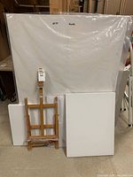 Photo showing all canvases, foam board, and easel together