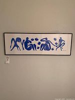 Full view of framed Henri Matisse art print 'Femmes et Singes' with blue cut-out style figures on white background.
