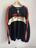 Front view of Harley Davidson sweatshirt displaying color pattern and embroidered logos.