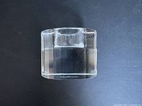 Top and side view of clear Rosenthal crystal candle holder with cylindrical design and hexagonal faceted base