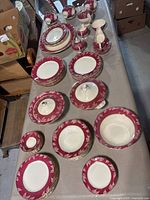 Overview of full dinnerware and teaware spread on table