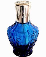 Front view of blue Lampe Berger Clochette lamp showing glass pattern and metal cap