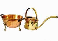 Colander and watering can side by side showing materials and design