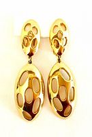 Frontal view of earrings showing openwork design