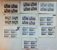 Nine Canada Post plate blocks of four $1 and $2 stamps displayed on cards