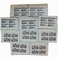 Nine intact blocks of four Canadian $1 and $2 stamps on original post office cardboard