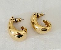 Front view of both gold-tone J hoop earrings