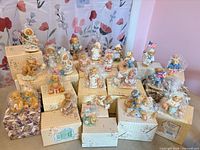 Group shot of 22 Cherished Teddies figurines and boxes