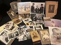 group shot of entire assortment spread on black surface showing variety of sizes and subjects