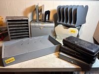 Group shot of all metal organizers, cases, bookends and drawer