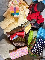 Overhead view of assorted fabric scraps, vinyl pieces, wool felt rolls