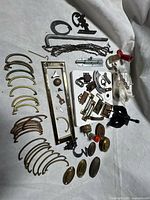 Overview of all mixed hardware pieces laid out on fabric