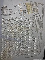 Overview of all chandelier crystals, prisms, bead chains and hooks laid out on surface