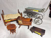 overview showing bed, cradle, carriage, table, chairs, bench