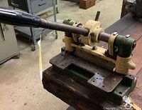 Front perspective view of bench shear showing lever handle, bearings and blade