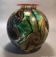 Front view showing swirling gemstone pattern and Isle of Wight Glassworks sticker