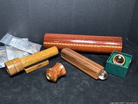 Eight wood and kit kaleidoscopes arranged showing variety of sizes, shapes, and packaging