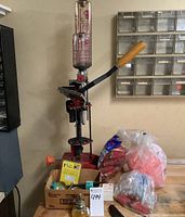 Full view of red MEC shotshell press on bench with accessories