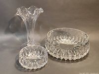 Simon Pearce Chelsea vase and two Gorham crystal bowls with intricate cut patterns, shown together from side angle
