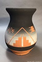 Front view of the vintage Sioux pottery vase showing geometric patterns and black and terracotta coloring.