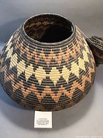 Front angled view of the Zululand basket showing the detailed geometric design in natural browns and black.