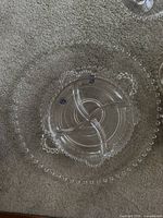Clear glass small divided serving tray with Candlewick beaded edging on rim and divided into four sections