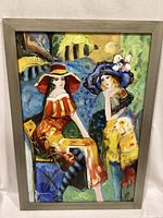 Full front view of the framed painting showing two abstract women wearing hats in vibrant colors