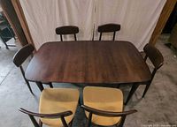 Overall overhead view of rectangular dining table surrounded by six chairs