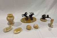Photo of all 8 pieces in the set showing arrangement and overall condition including bronze chariots, onyx vase, dishes and egg-shaped stones.