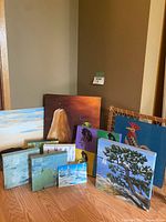 Group view of 10 assorted original paintings including pears, birds, abstract textures, and landscapes