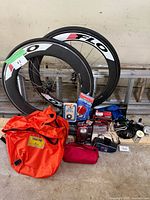 Full lot: two carbon wheels, gear bag, mirror, lights, lock, bell, pouch
