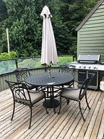 Full set on deck: table, chairs, umbrella, base stand