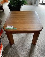Side view of the solid oak square side table showing the wood grain and leg design