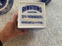 Bottom view of square tea container showing Ringtons Limited Tea Merchants Newcastle upon Tyne marking