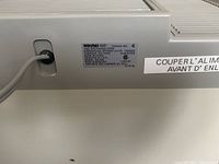 Close-up of product label showing model and electrical specifications, Holmes Air evaporative humidifier.